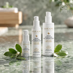 Trois flacons de crème Anti-imperfections ODÉANE de tailles différentes, entourés de feuilles, avec logo ECOCERT COSMOS NATURAL en haut à droite.